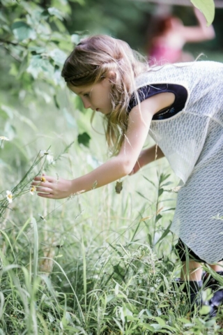 Young Girl Picking Flowers